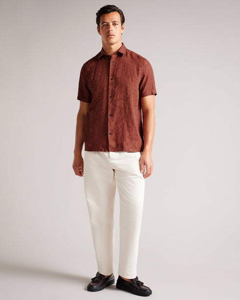 CHAPLN-Shirts-How can CHAPLN look this good? The secret is all in the details: a relaxed fit, short sleeves and an intricate coral print. If you love laid-back style and the comfort of linen, then this shirt is for you.This product is made from European Flax Linen. It is farmed using no irrigation and no pesticides, helping to reduce water and chemical usage. Button up shirt 100% Linen Short sleeved Coral print Classic collar Relaxed fit James is 6'0" / 1.83m and wears Maroon in a size 3- Ted Baker Romania